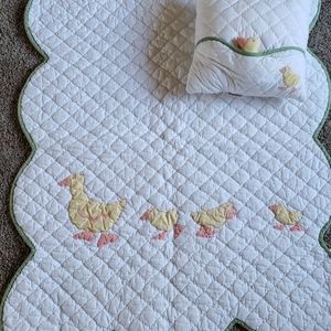 Infant comforter and pillow set.